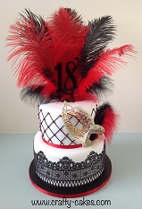 Masquerade black & red cake with edible lace